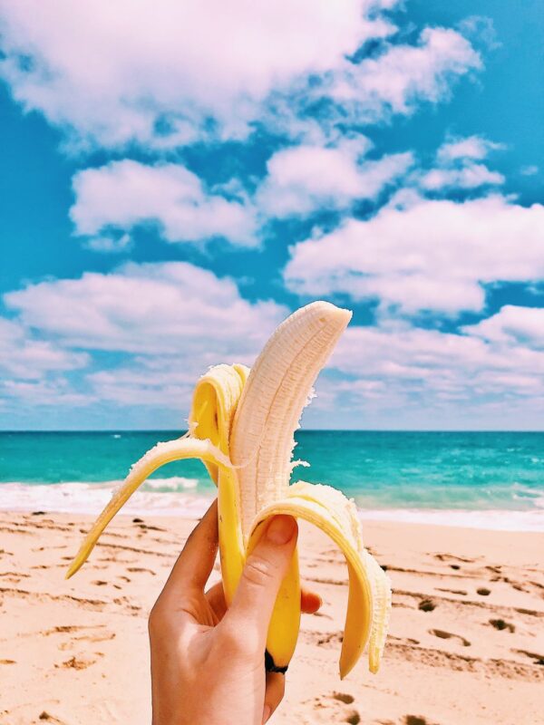 eating a banana at the beach
