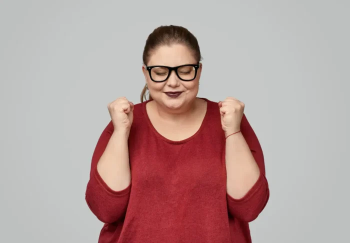 plus size woman making a wish to bea healthy