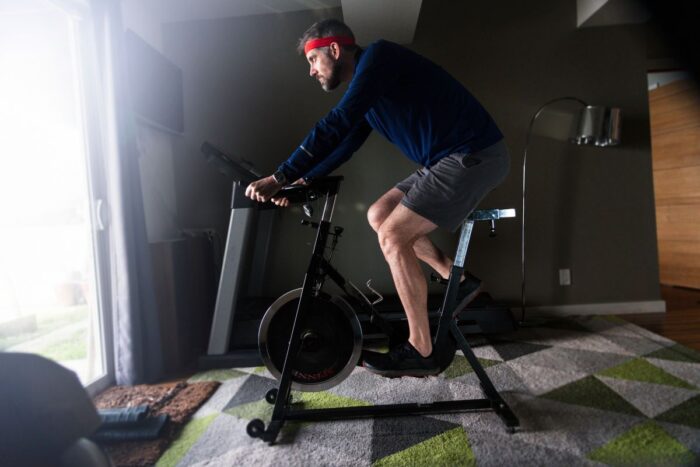 man exercising on stationary bike