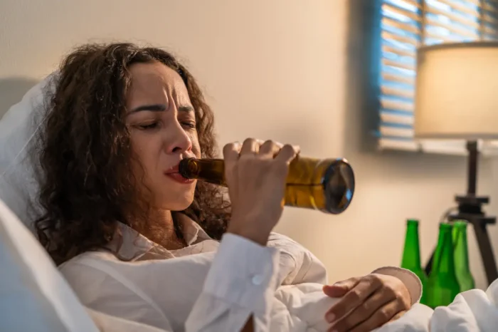 a woman struggling with drinking