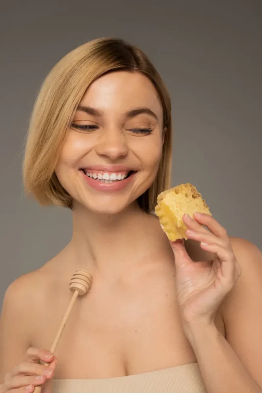 woman holding a Honeycomb