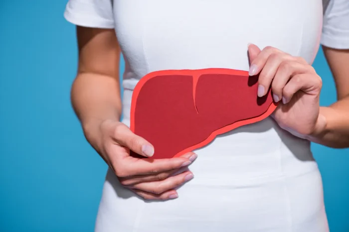 woman holding a liver illustration
